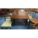Mahogany wind-out dining table with 1 leaf and winder and 8 upholstered rope back chairs. Table 40”d