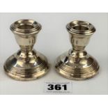 Pair of small silver weighted candlesticks, 2.5” high, total w: 4.2 ozt