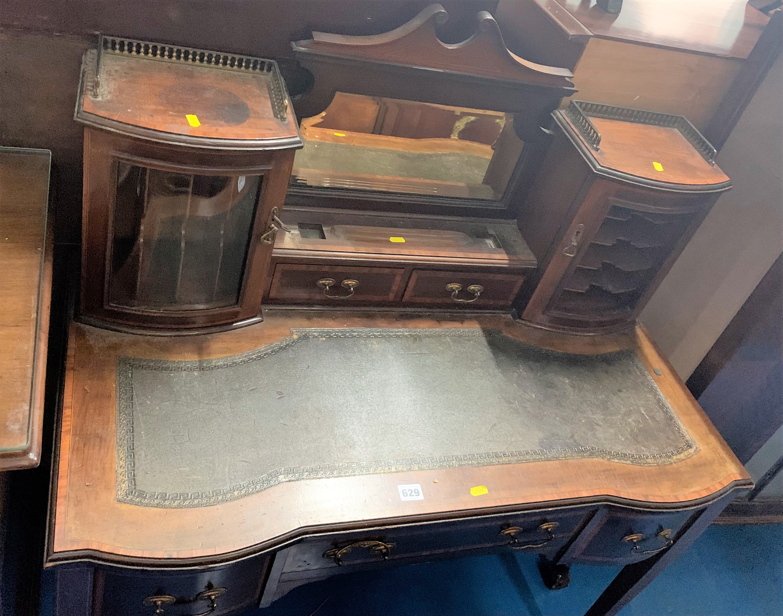 Leather top writing desk with inkstand, mirror and cupboards above (glass missing), 3 drawers below.