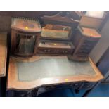 Leather top writing desk with inkstand, mirror and cupboards above (glass missing), 3 drawers below.