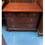 Slimline oak bureau with drop desk and 2 shelves underneath. Brass hinges. 25”w x 7”d x 48”h