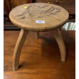 Pine 3-legged stool with carved horse’s head seat, 11” dia x 13”h