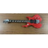 red electric guitar in Styrofoam case bearing Ibanez Logo