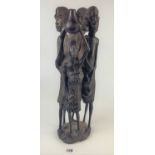 Carved wooden African 4-figure statue, 19” high