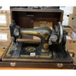 Antique Singer hand sewing machine in case. 17.5”w x 8.5”d x 12”h