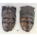 2 heavy wooden carved tribal masks, 12” long