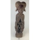 Wooden carved fertility goddess figure, 23” high