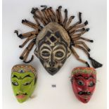 Wooden carved tribal witch doctor mask and 2 painted face masks