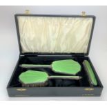 Cased 3 piece silver and enamel brush set comprising hairbrush, clothes brush and hand mirror