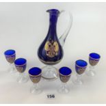 Russian gilded blue glass vodka set comprising jug and 6 glasses. Jug 9.5” high