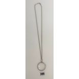 Silver necklace 29” long with silver rimmed magnifying glass pendant 2” long, total w: 1 ozt