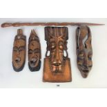 3 carved wooden tribal masks, 1 metal tribal mask and 1 tribal staff, 37” long)