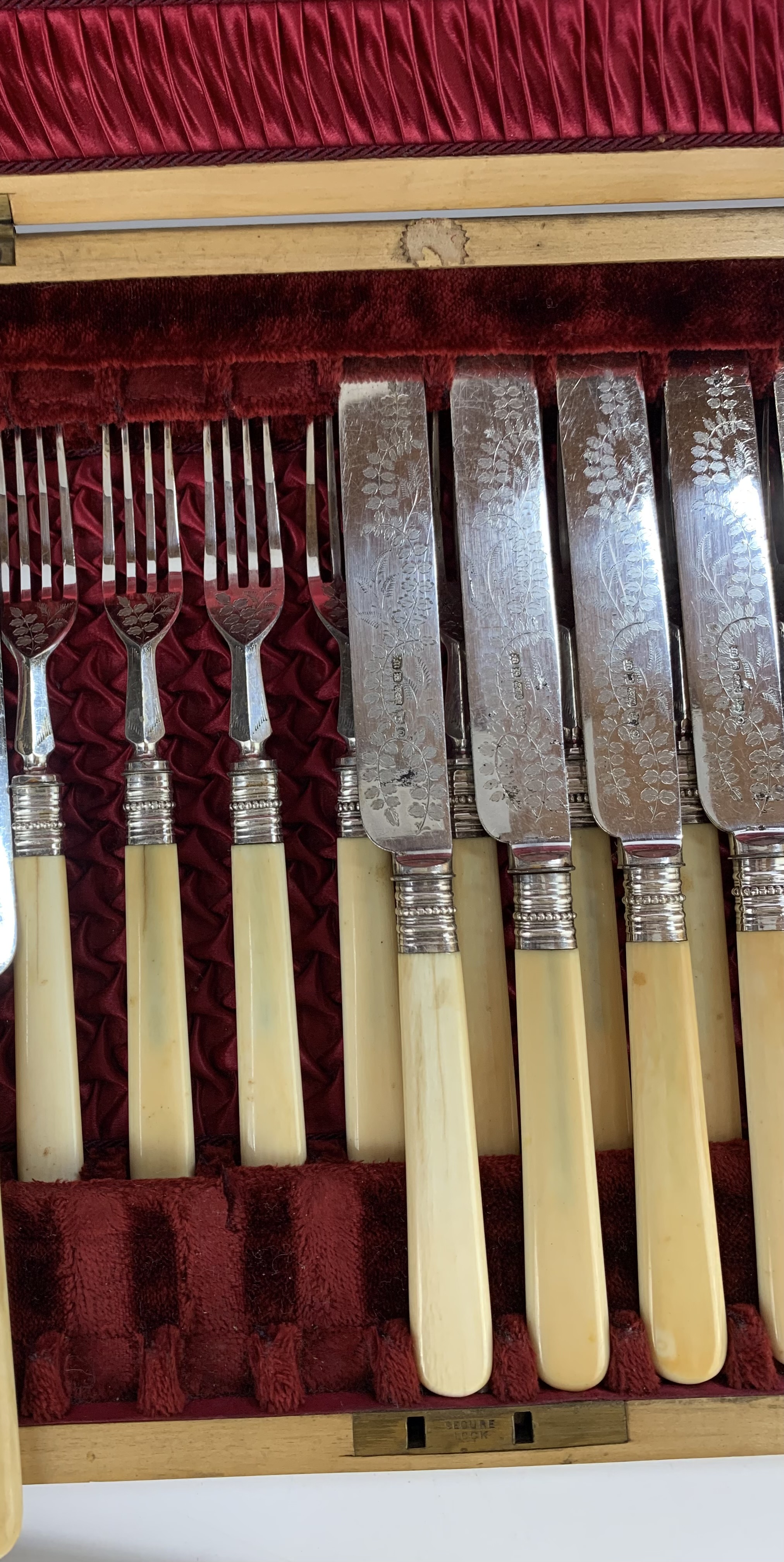 Cased canteen of 11 engraved plated and bone handled knives and 11 forks (1 knife and 1 fork - Image 6 of 8