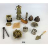 Assorted metalware including small miners lamp, hub caps, Ronson lighter, 50 year calendar,