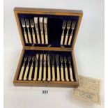 Cased canteen of 12 plated and bone handled cake forks and 9 knives (3 knives missing)