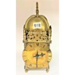 Brass lantern clock with key. 12.5” high