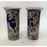 Pair of Wilton Ware lustre vases with peacock and foliage design, 10” high. Good condition