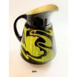 Large Bretby green/brown jug with fish design, 13” high. Small chips to underneath of rim