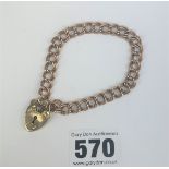 9k gold gate bracelet with heart lock, 7.5” long, w: 12.1 gms