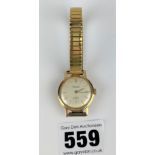 Gold plated Rotary watch on elasticated strap. Running