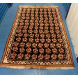 Red flower design rug, 81” x 54”