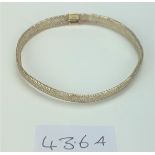 9k gold mesh elasticated bangle, 8” circumference, w: 1.2 gms