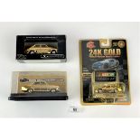 3 boxed gold-plated cars – 2 Trax and 1 Racing Champions