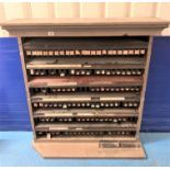 Bus ticket cabinet/stand with shelves of bus tickets. 42” w x 11” d x 46”h