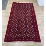 Red geometric design rug, 82” x 46”