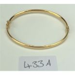 9k gold bangle, 8” circumference, w: 3.9 gms