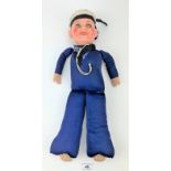 Wind-up musical sailor doll with pot head and soft body, 17” long. Damaged ear