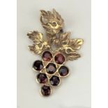 9k gold pendant with red garnets and pair of red garnet earrings, total w: 4.7 gms