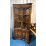 Large concave shaped mahogany corner cabinet with 2-door base cupboard and 2 glazed doors at top,