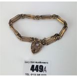 9k rose gold gate bracelet with heart lock, 7” long, w: 13.9 gms
