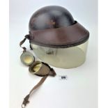 Vintage leather crash named helmet with visor and pair of goggles