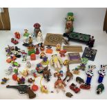 Miniature pool table, dartboard, clackers, plastic robot, gun, Leprauchan, McDonalds toys etc