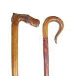 Greek hardwood walking stick, the handle carved with a stylised horse head and mask of a