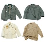 Two reproduction German military dress tunics; together with a reproduction Luftwaffe DAK shirt