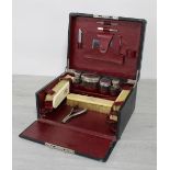Vintage gentleman's fitted dressing/vanity case, the hinge cover fall front revealing fitted