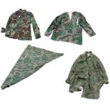 Selection of reproduction German camouflage uniform smock, jacket, overcoat and heavy weight