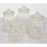 Four moulded glass storage jars, tallest 12.5" high (4)