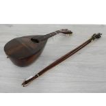 Neapolitan mandolin labelled Pietro Tonelli, 24" long overall; together with four violin bows