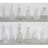 Selection of 12 assorted glass decanters with stoppers, tallest 14" high