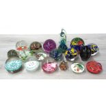 Collection of assorted coloured glass paperweights including a Mdina seahorse paperweight, Murano