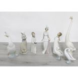 Lladro porcelain figurine 'Talk of the Town', no.5788, 10.25" high; together with two further Lladro