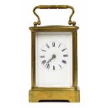 Carriage clock striking on a bell, within a corniche brass case, 6" high