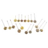 Seventeen small clock pendulums all fitted with central threaded regulation adjustment wheels (17)