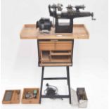 The 'Portass' electric lathe made by The Heeley Motor & Manufacturing Co..., mounted onto a stand