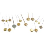 Sixteen small clock pendulums (16)