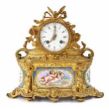 Small French ormolu and porcelain panelled two train drumhead mantel clock, the Japy Fils movement